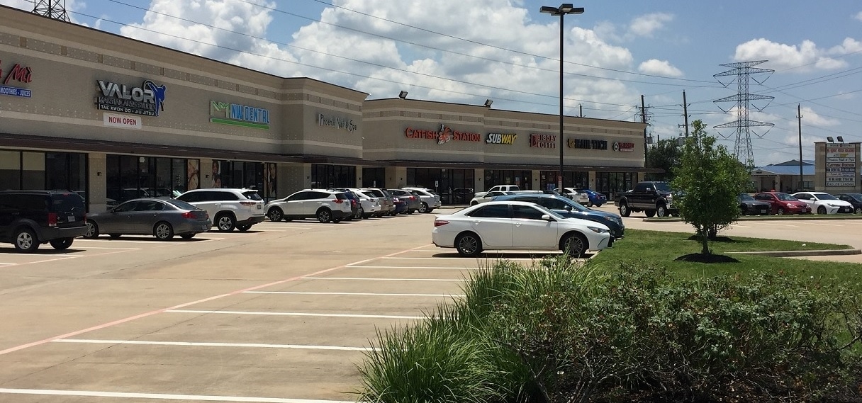 Storefront row and surface parking at Eagles Landing on Huffmeister