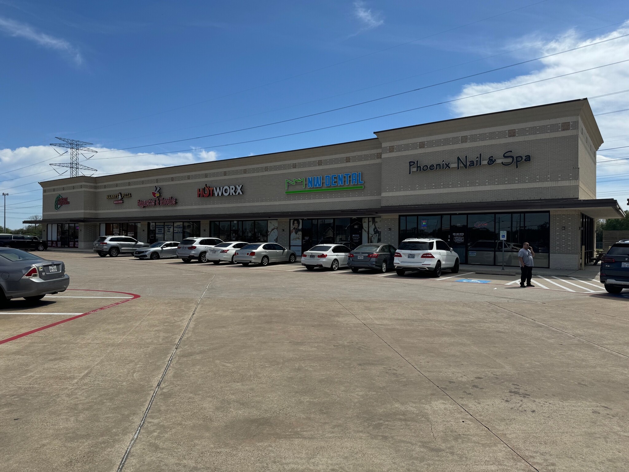 Retail storefronts facing the central parking and courtyard area