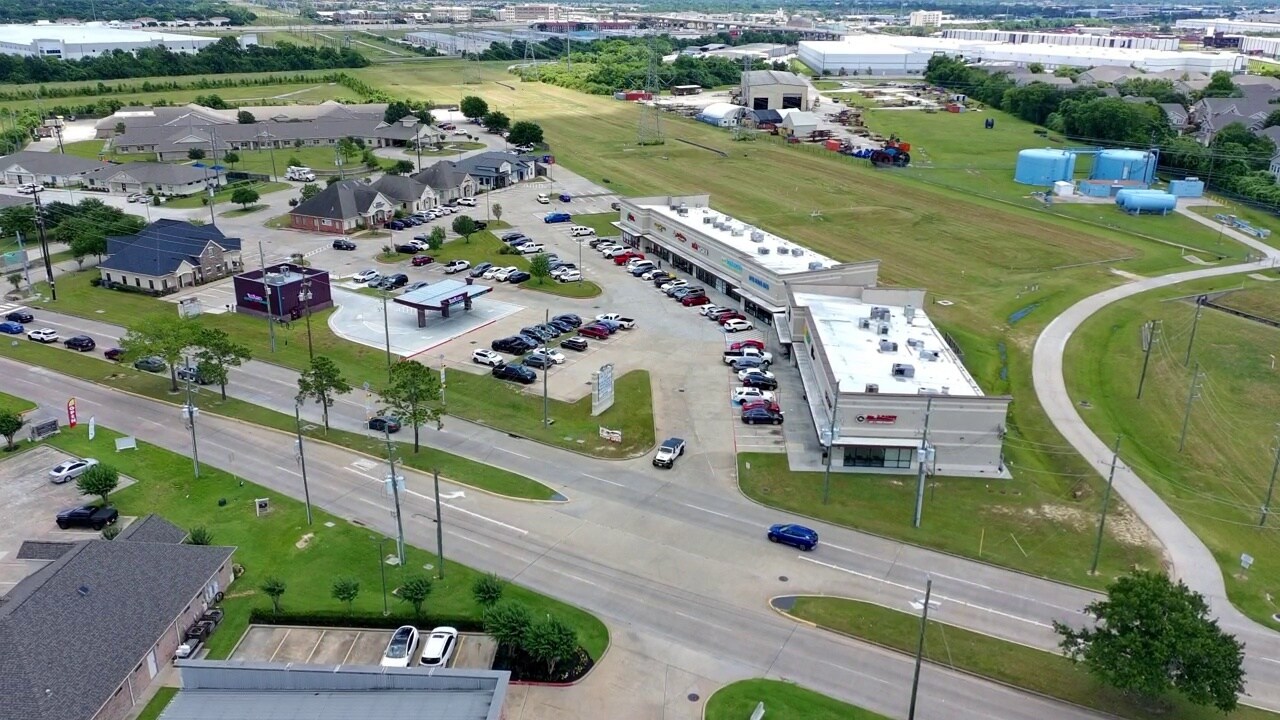 Aerial view of the retail property, access roads and nearby development