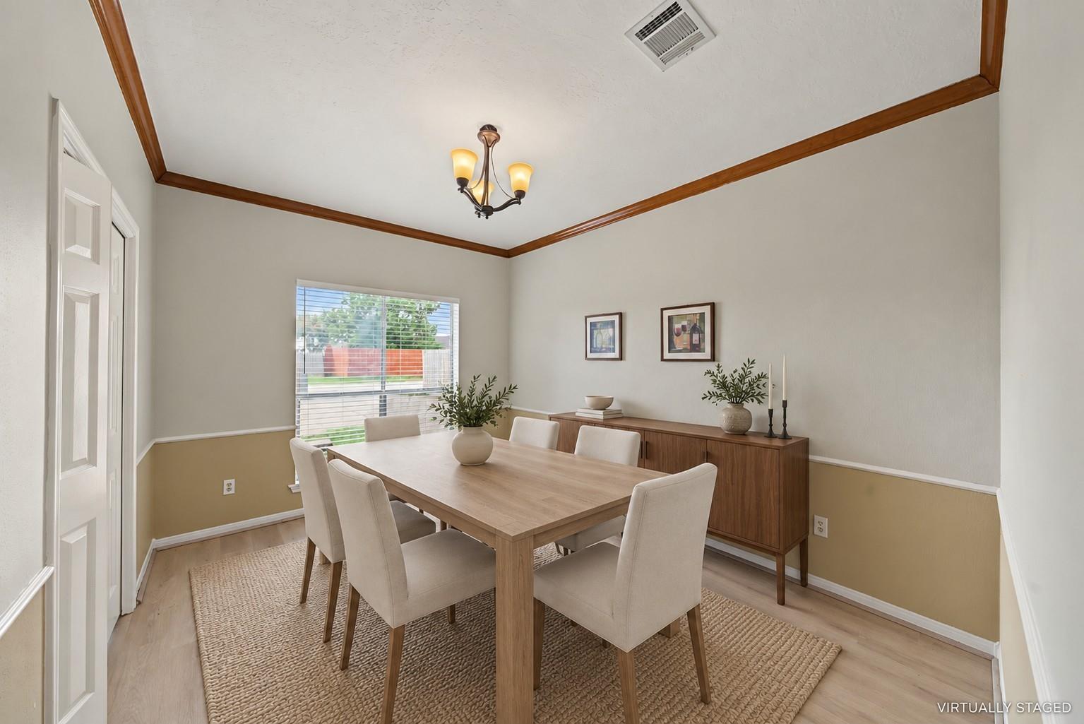 Virtually staged formal dining room at 1411 Guadalupe St