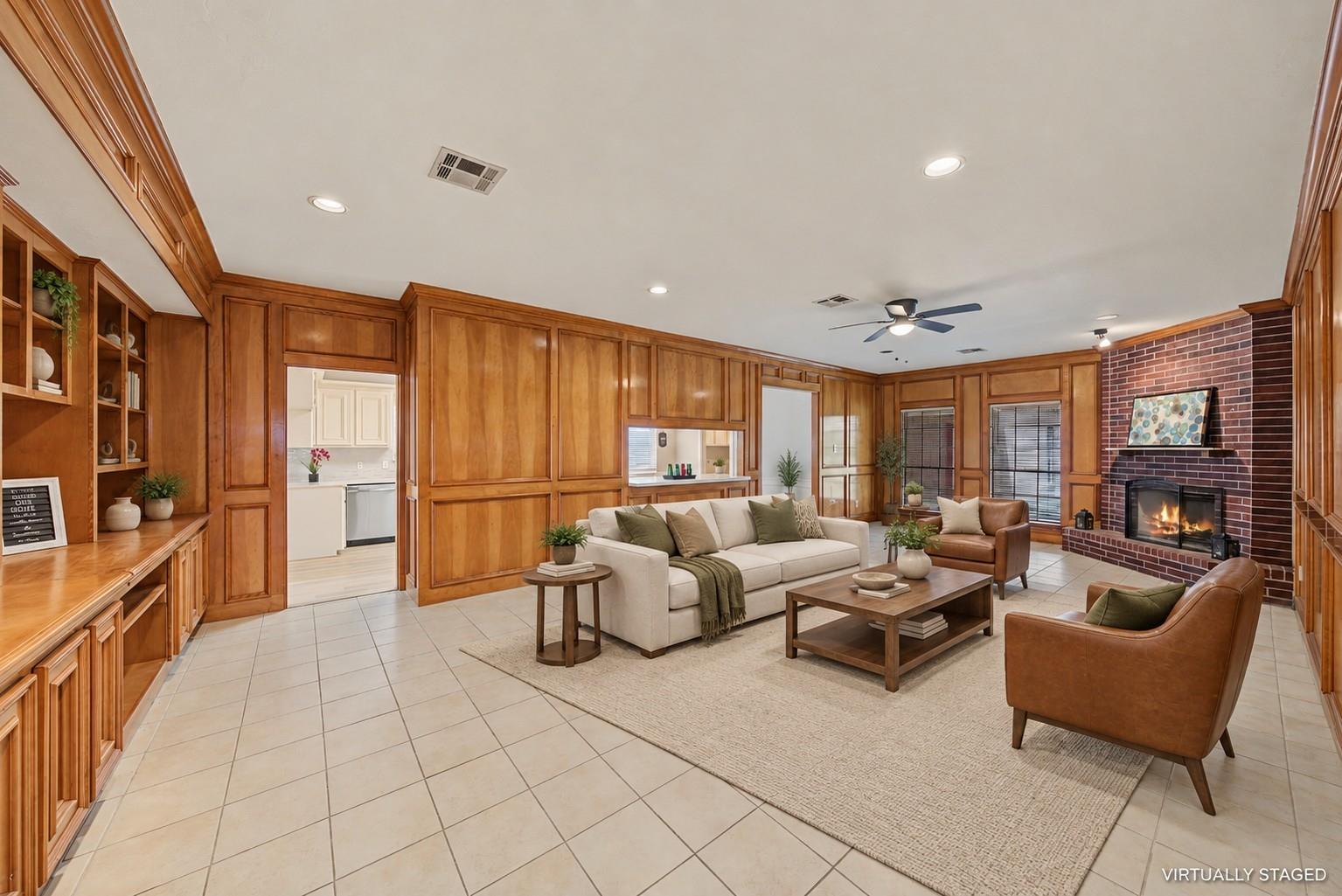 Family room with fireplace and built-in cabinetry at 1411 Guadalupe St