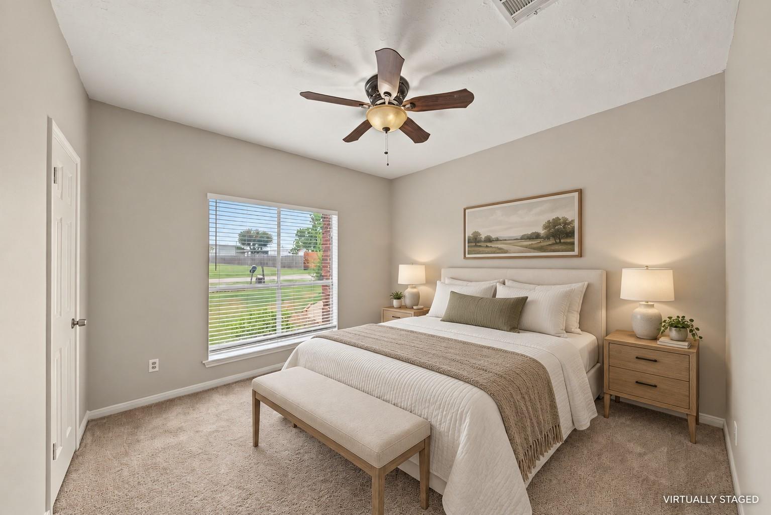 Virtually staged primary bedroom at 1411 Guadalupe St