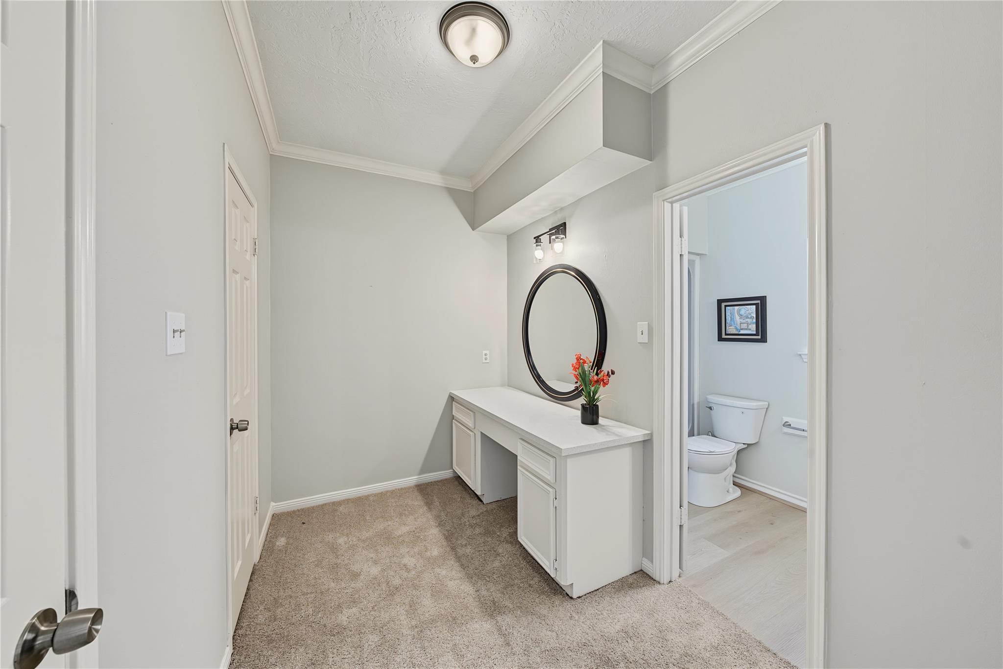 Bathroom vanity and hallway at 1411 Guadalupe St