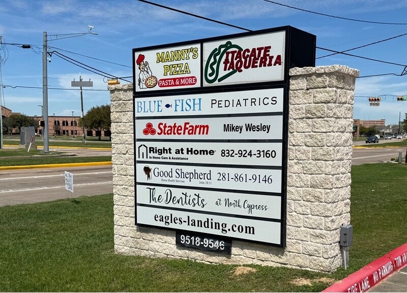 Tenant directory monument sign at the retail center entrance