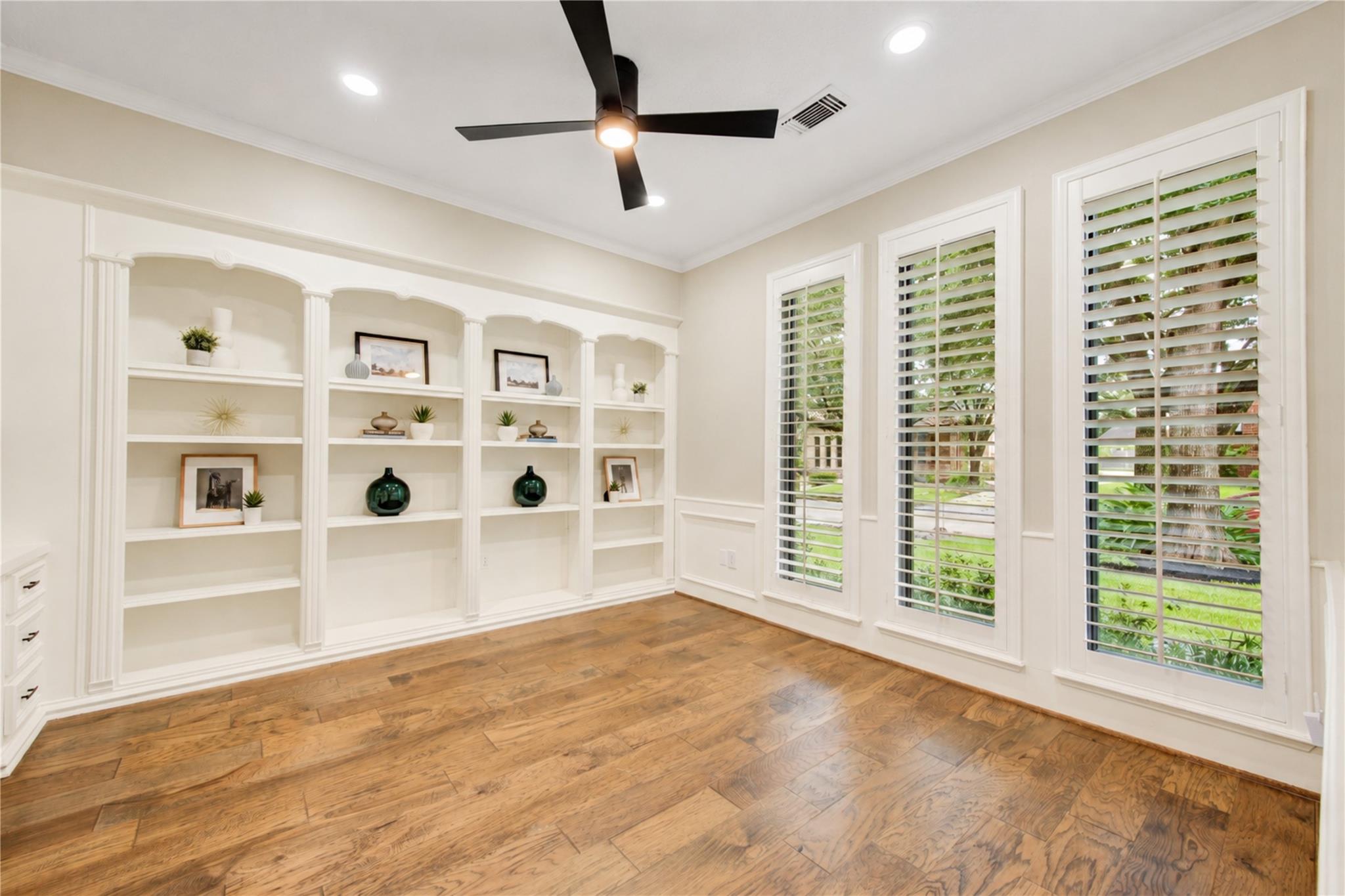 Home office with built-in shelving at 19822 Summerset Way