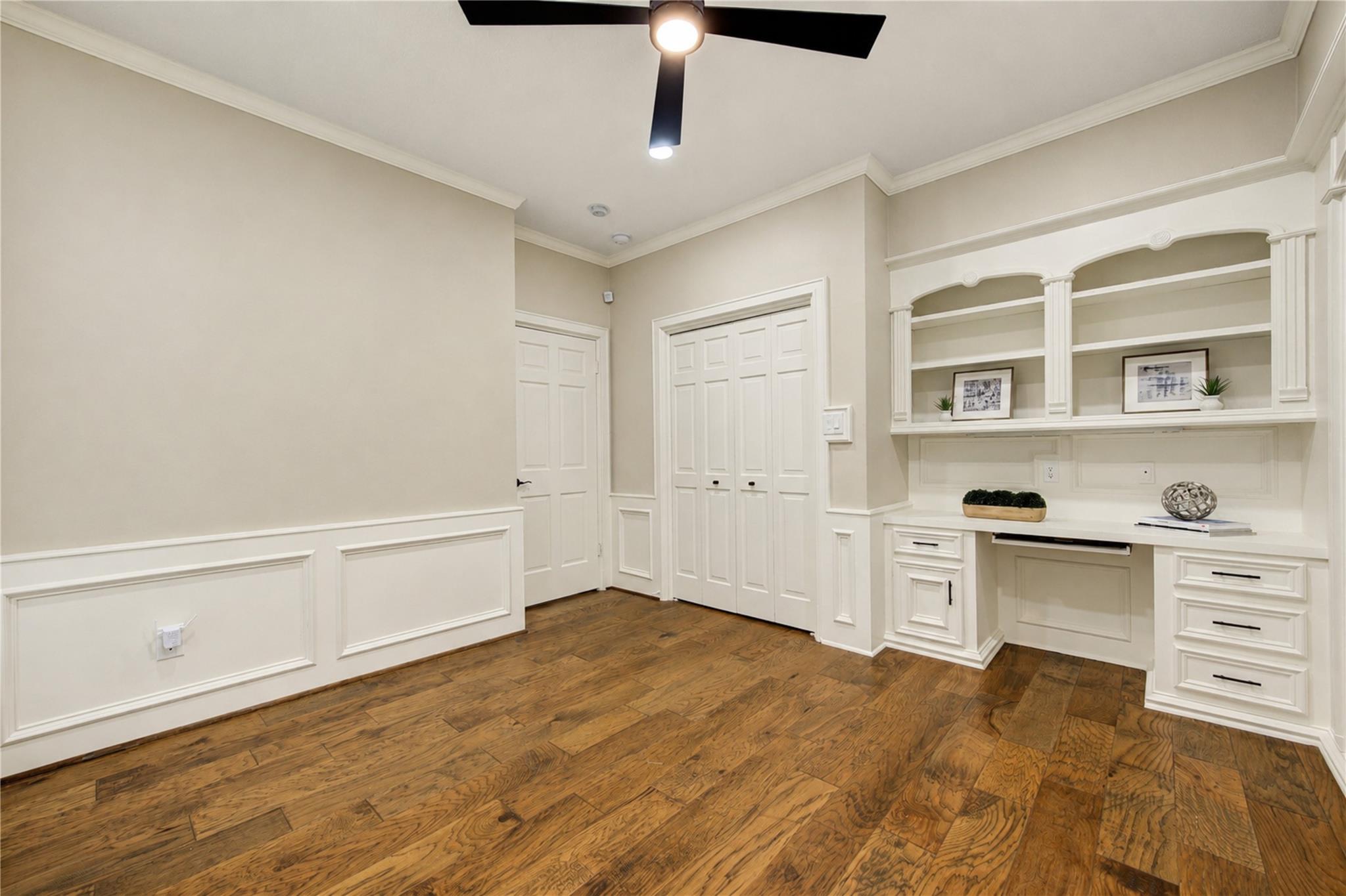 Home office with built-in desk at 19822 Summerset Way