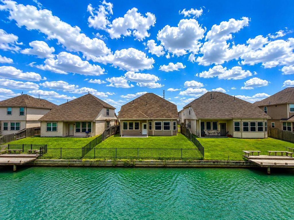 Waterfront backyard of 24635 Signorelli Way in Katy