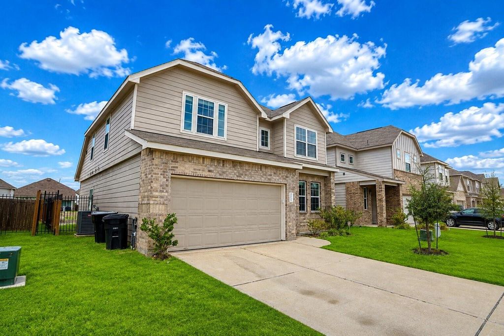 Angled front exterior and two-car garage at 24635 Signorelli Way