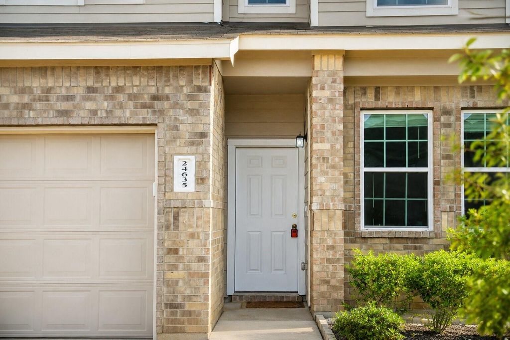 Covered front entry and address detail at 24635 Signorelli Way