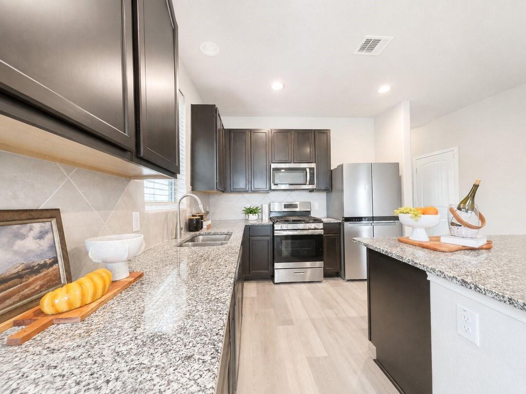 Kitchen with granite counters and stainless appliances
