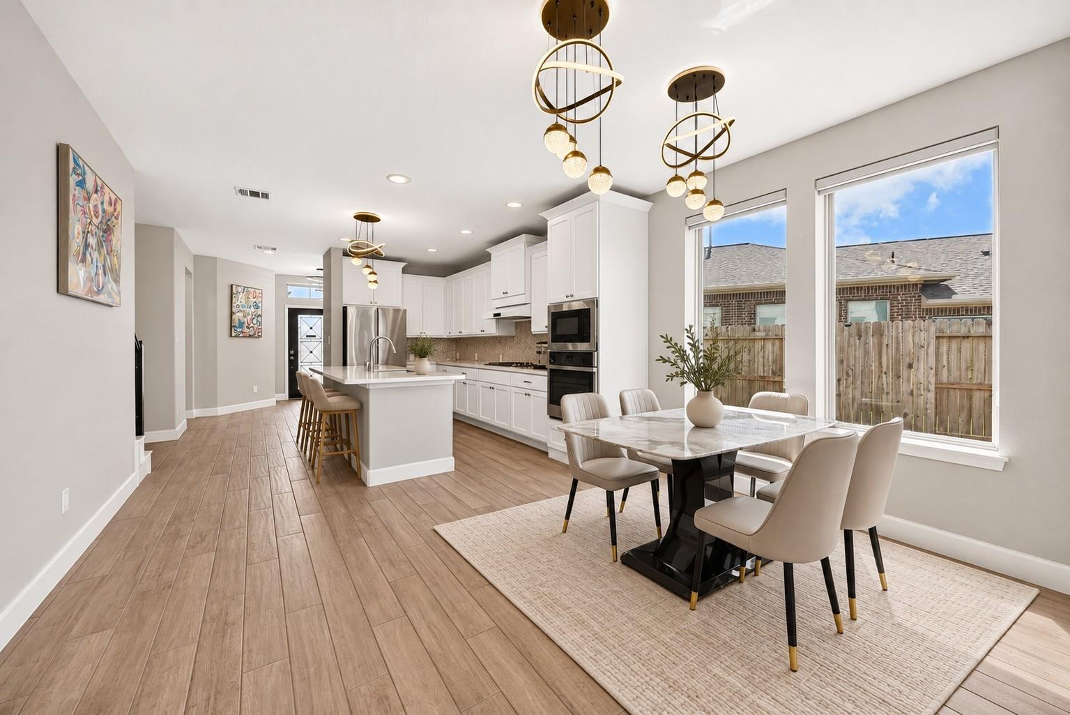 Open dining area and kitchen at 2534 Alder Wood Ln