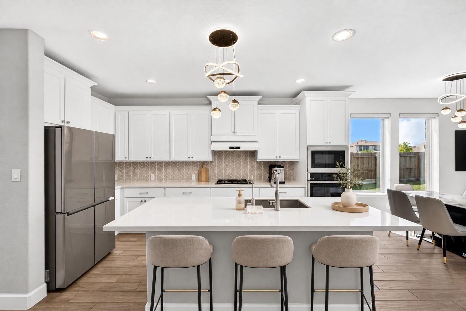 Kitchen island and breakfast seating at 2534 Alder Wood Ln