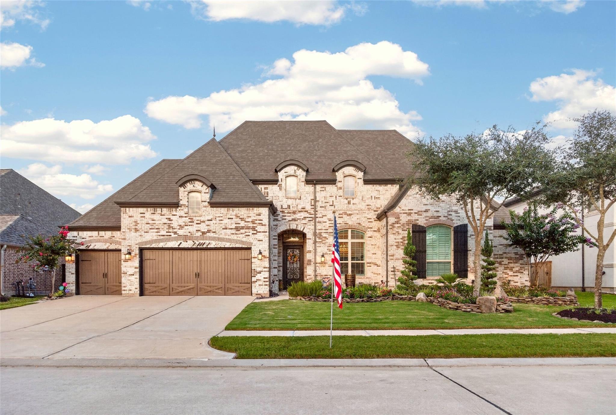 Stone front elevation and entry at 2710 Merlin Way