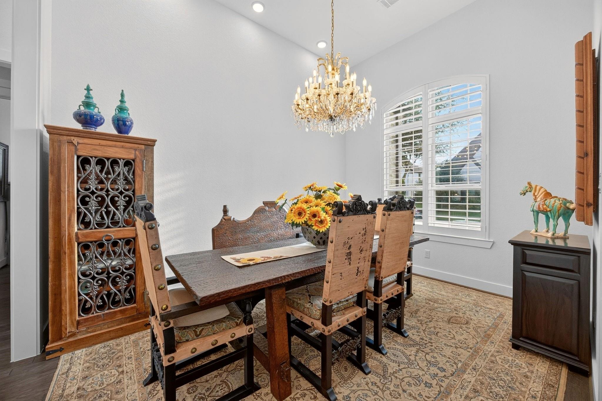 Formal dining room with designer lighting at 2710 Merlin Way