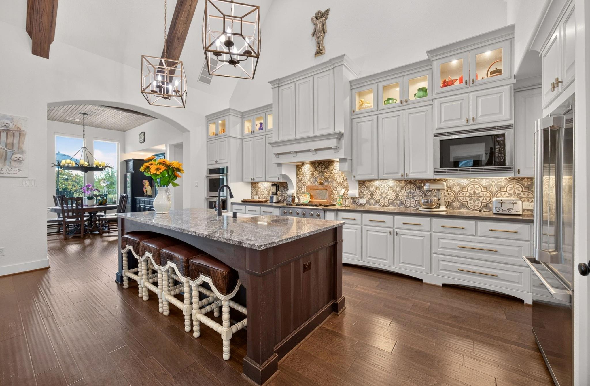 Chef kitchen with oversized island at 2710 Merlin Way