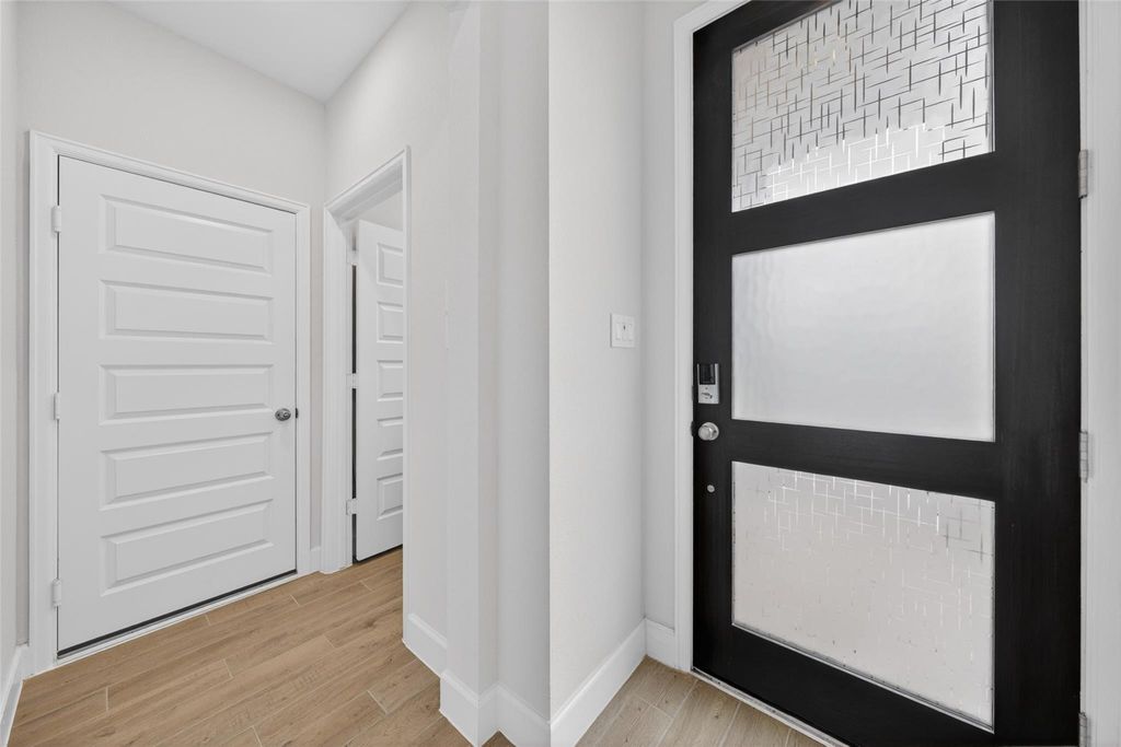 Modern entry door and foyer at 2867 Orange Leaf Dr