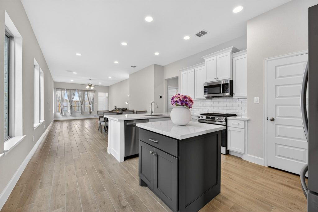 Open-concept kitchen and living area at 2867 Orange Leaf Dr