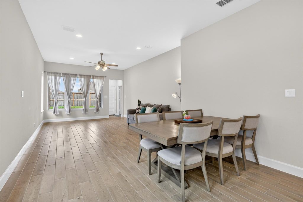 Open dining and living space at 2867 Orange Leaf Dr