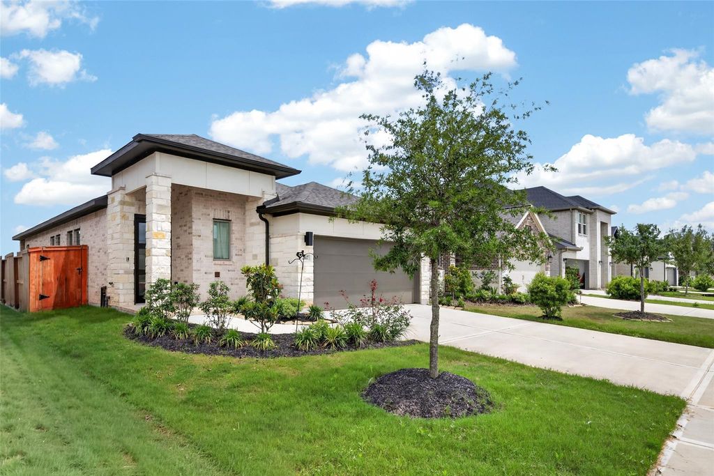 Side exterior and landscaped corner of 2867 Orange Leaf Dr