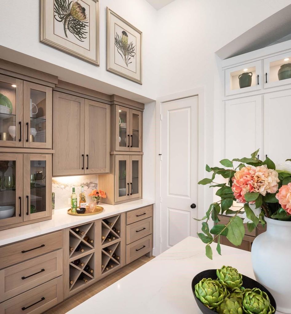 Custom kitchen cabinetry and built-in wine storage at 29623 Apple Glen Court