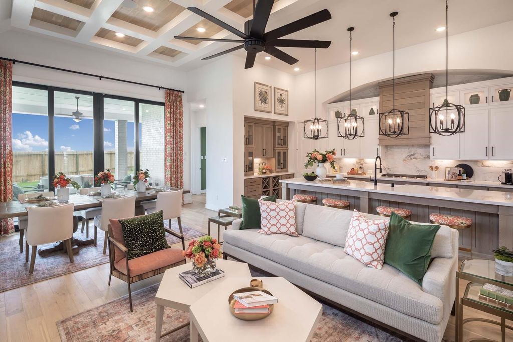 Open-concept living, dining and kitchen area at 29623 Apple Glen Court