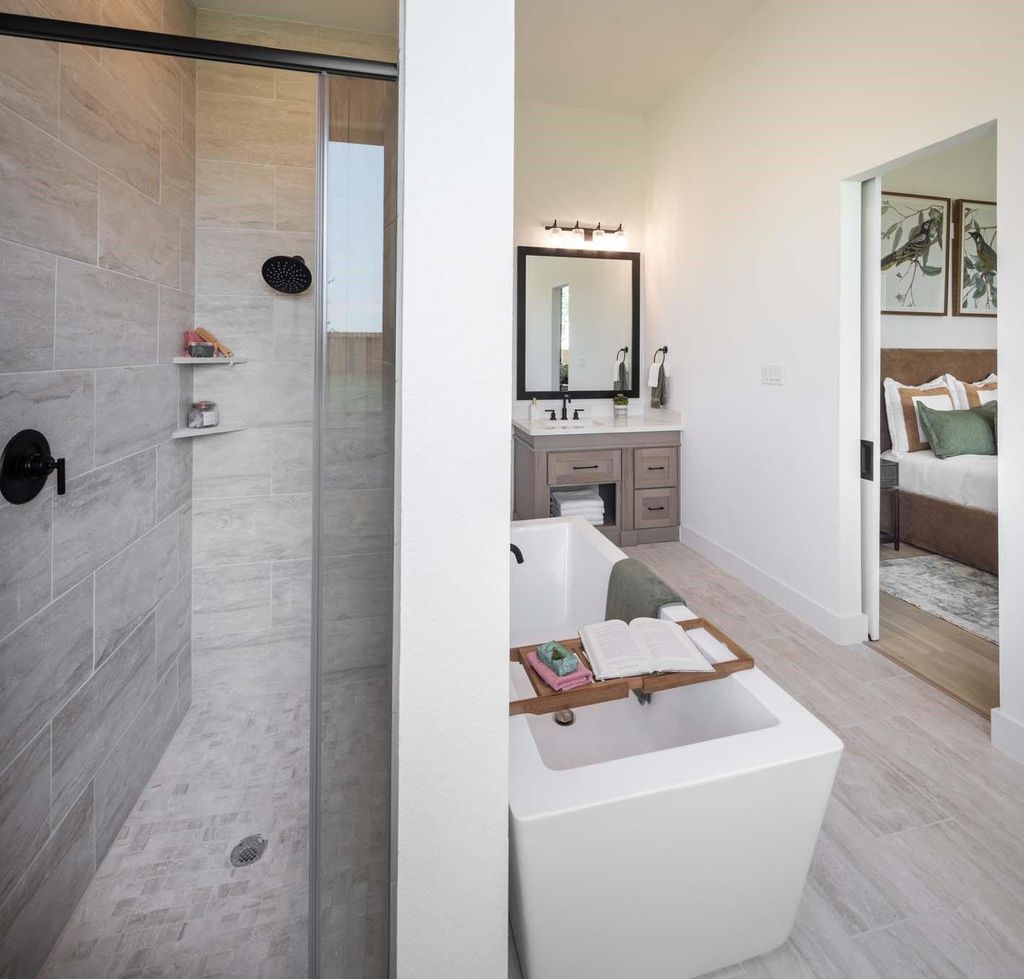 Primary bathroom walk-in shower and vanity at 29623 Apple Glen Court