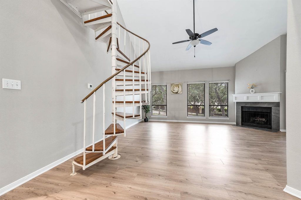 Vaulted living room and spiral staircase at 4144 Greystone Way Unit 105