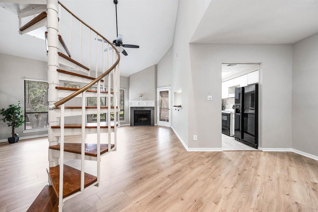 Open living area with kitchen view at 4144 Greystone Way Unit 105