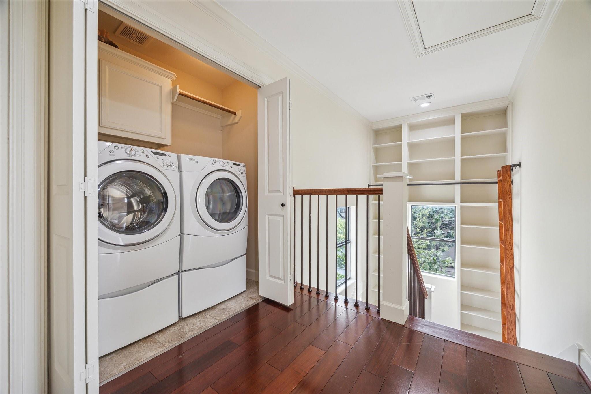 Third-floor laundry area with washer and dryer
