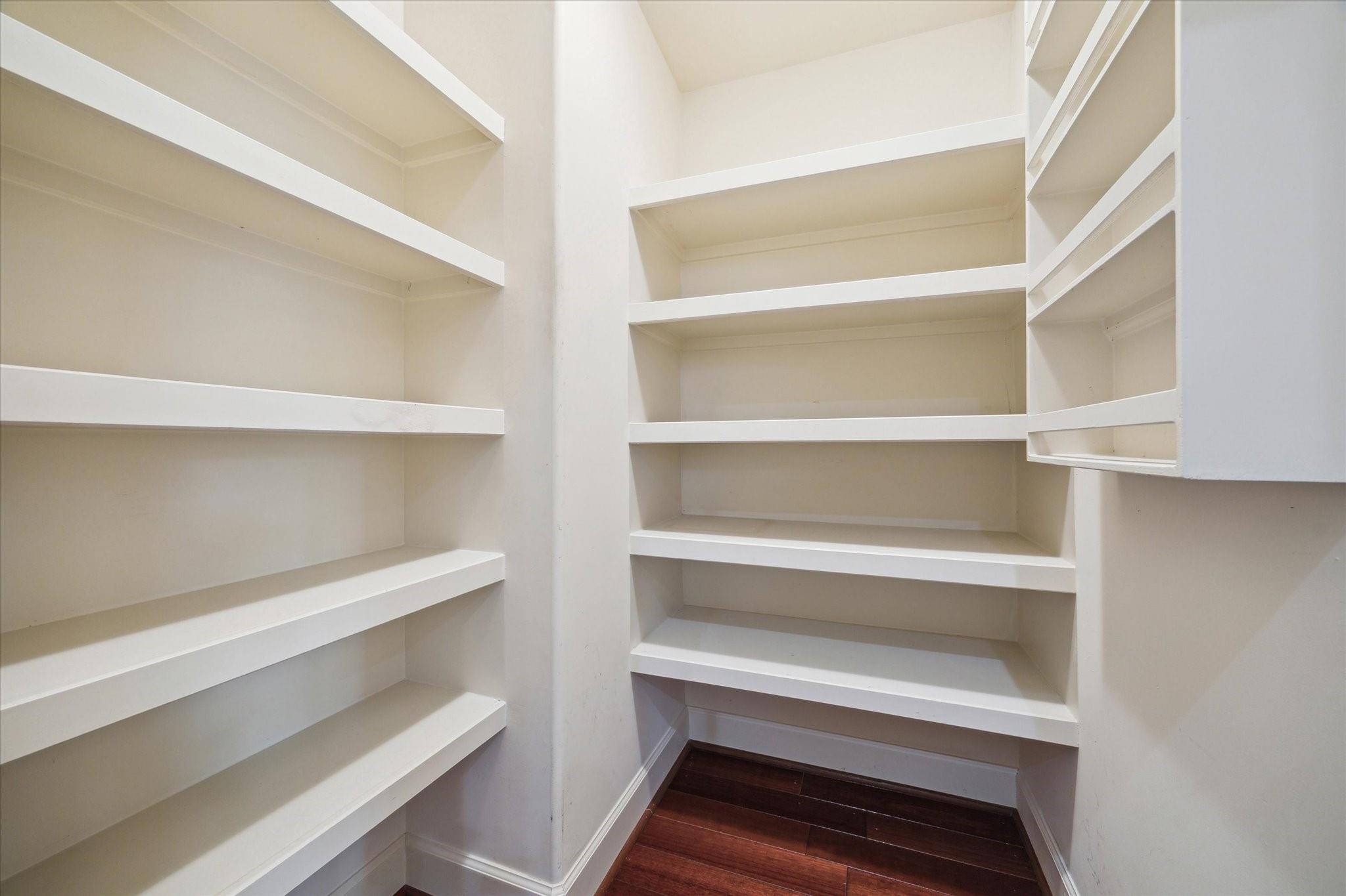 Walk-in pantry with built-in shelving