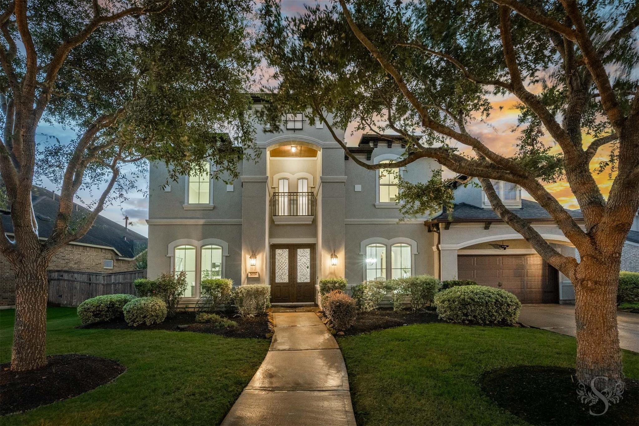 Lakefront exterior of 5026 Quiet Falls Lane in Cross Creek Ranch