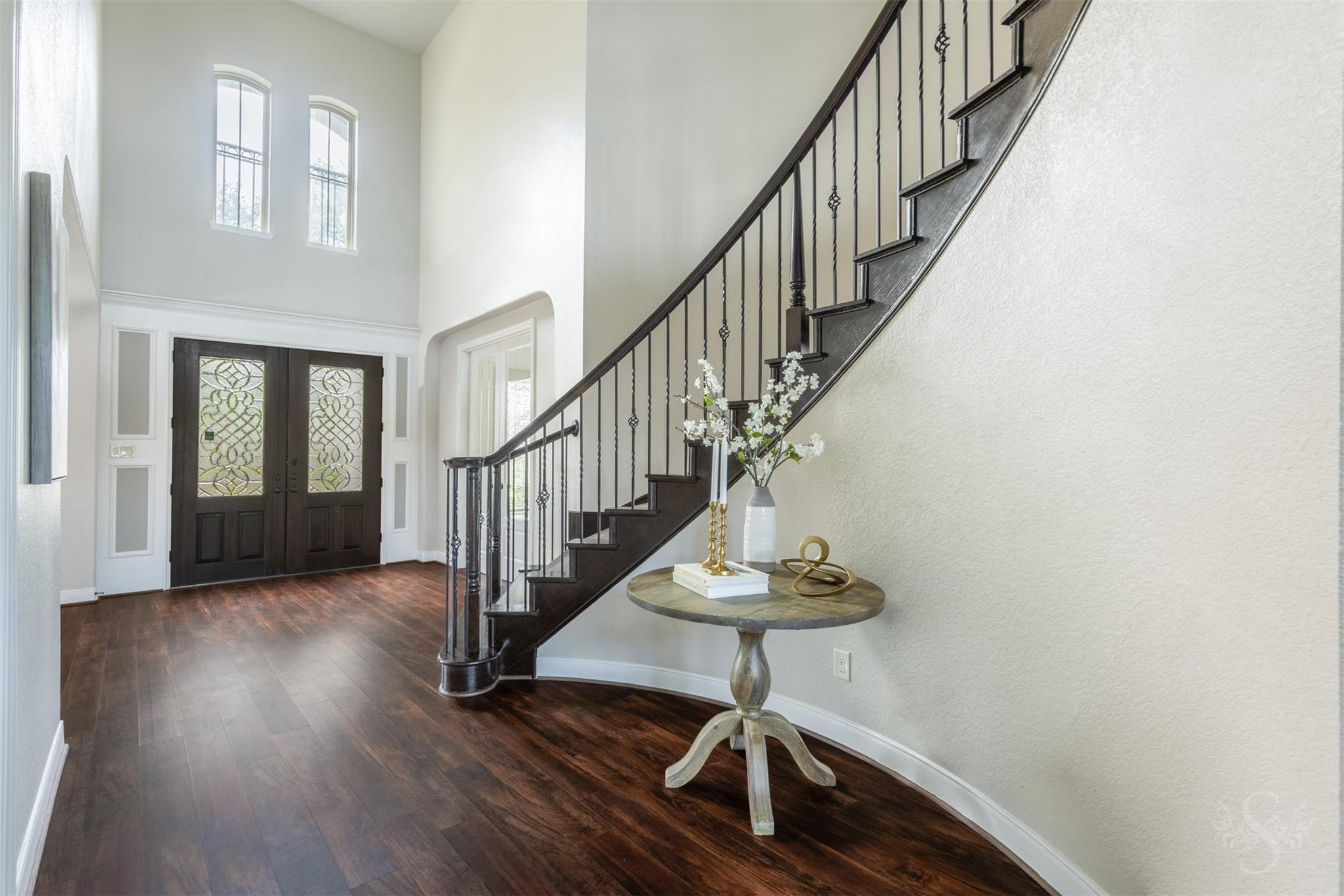 Grand foyer with double front doors at 5026 Quiet Falls Lane