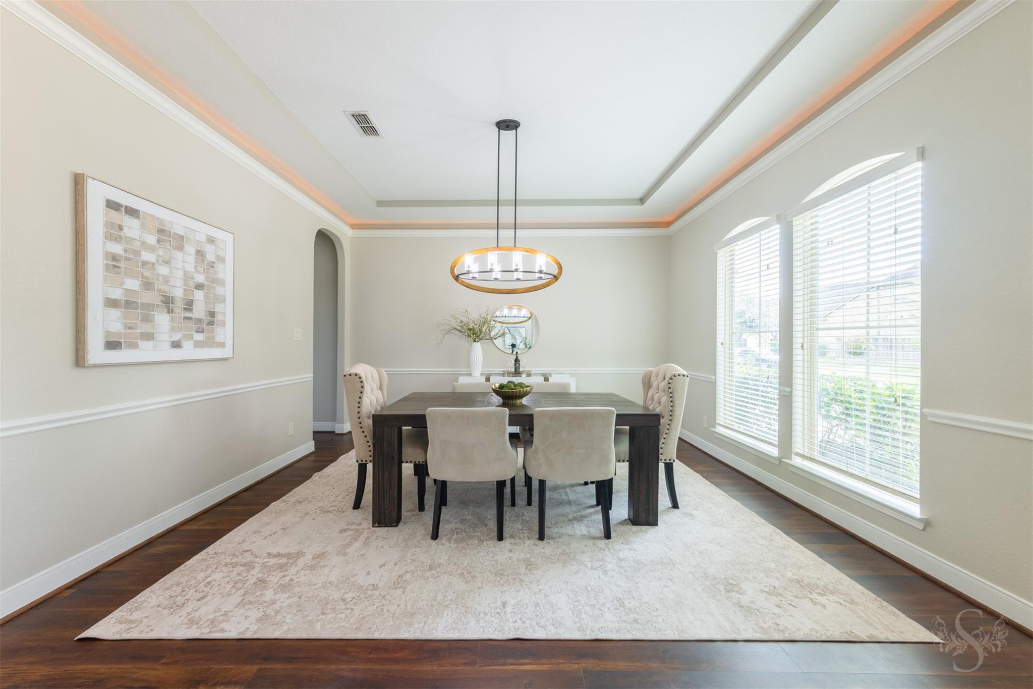 Formal dining room with tray ceiling at 5026 Quiet Falls Lane