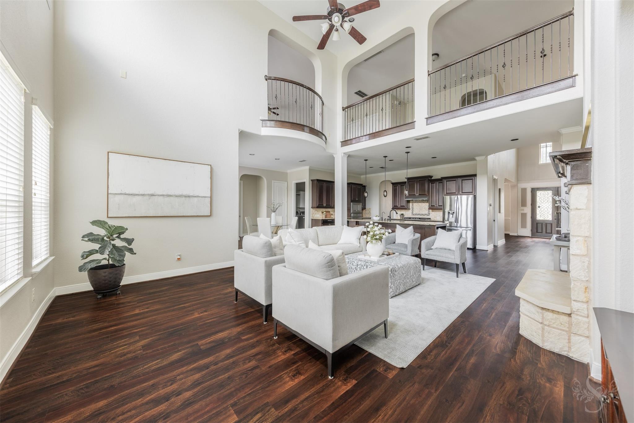 Second-floor balcony overlooking the family room at 5026 Quiet Falls Lane