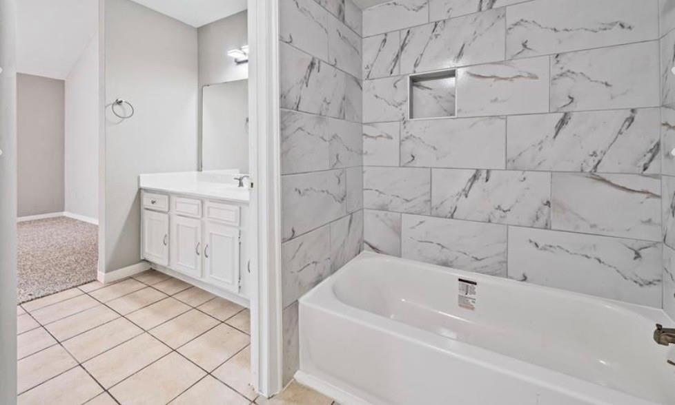 Bathroom with updated vanity and tub surround