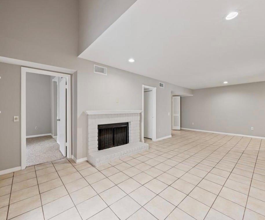 Living area with fireplace at 9809 Richmond Avenue Unit E14