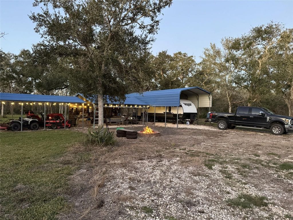 Recreational setup under metal canopies on the 25-acre Cedar Lake tract