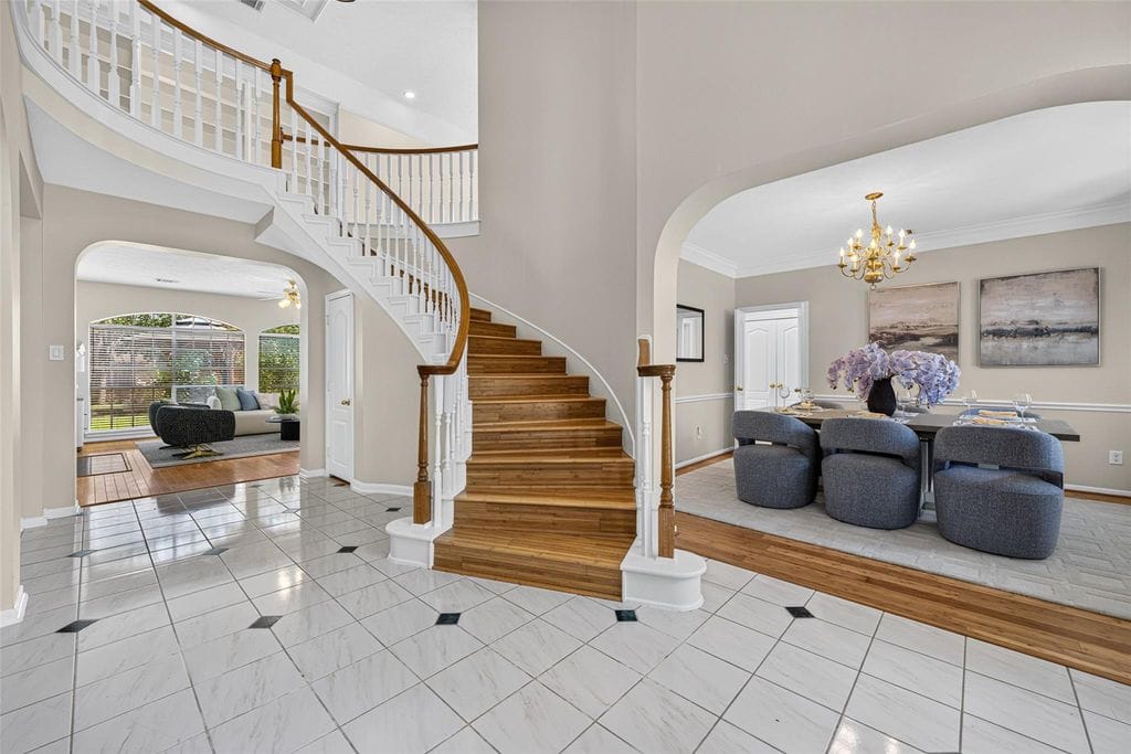 Two-story foyer with curved staircase at 2819 Gray Moss Ct