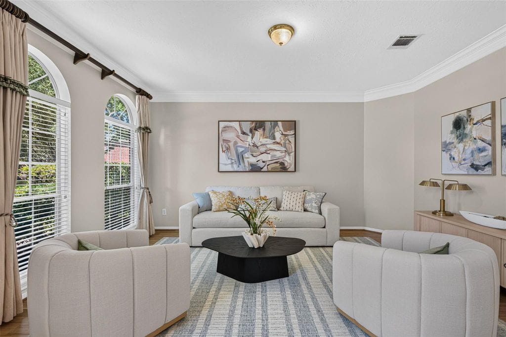Formal living room with arched windows at 2819 Gray Moss Ct