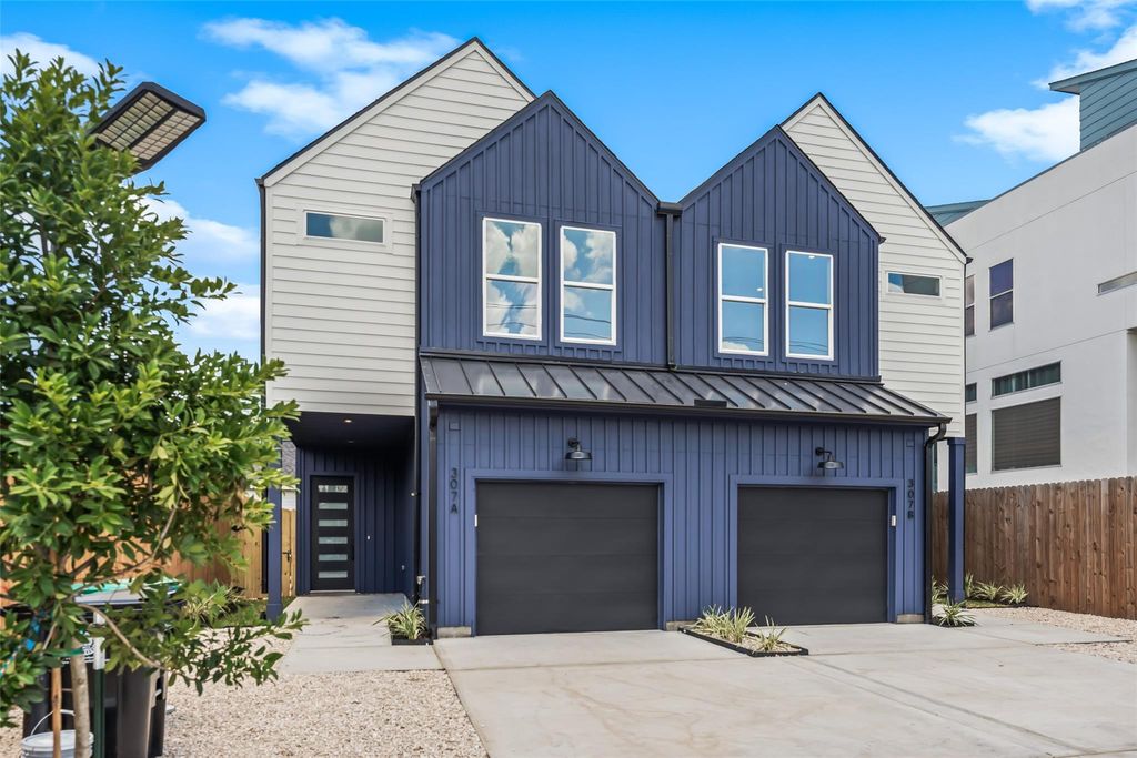Front exterior of the complete 307 Quitman St duplex with two private garages | 307 Quitman St整栋双拼住宅正面及两个独立车库