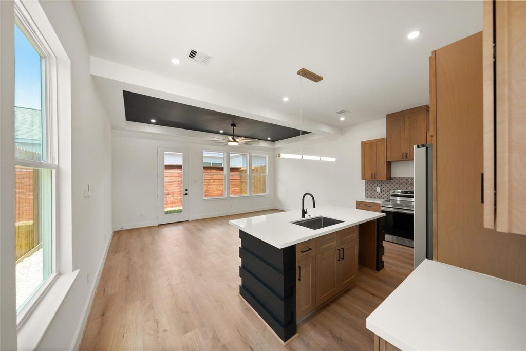 Unit A kitchen island and open dining-living area | A单元厨房岛台及开放式餐客厅