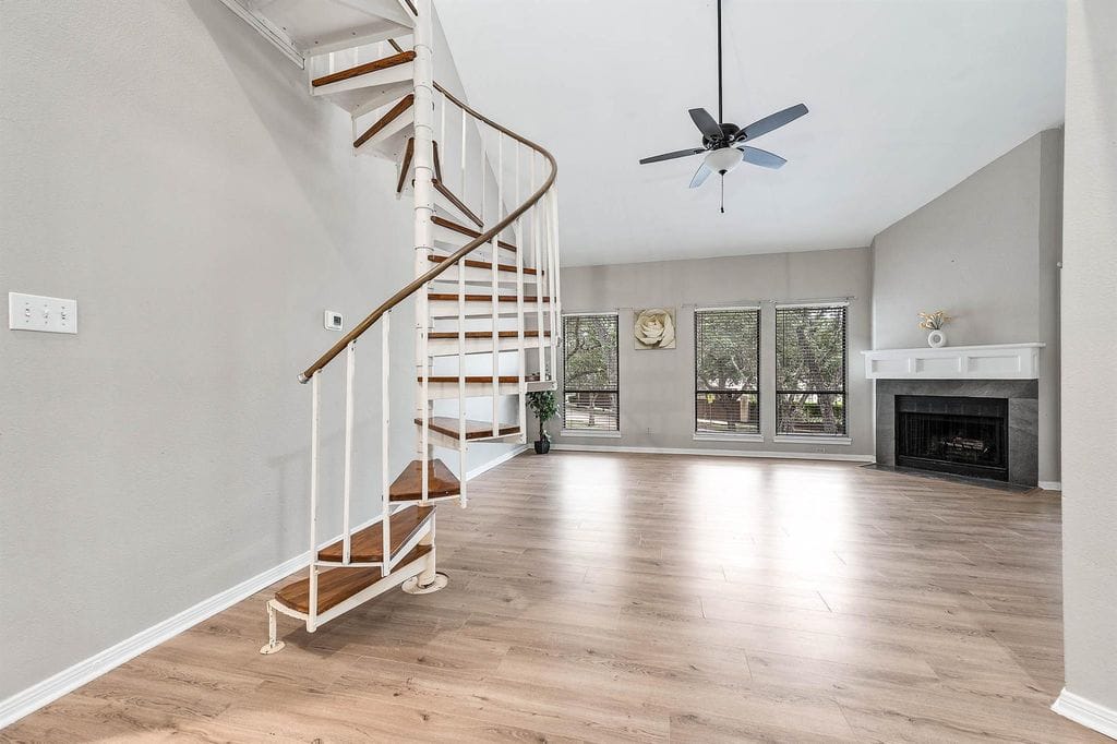 Vaulted living room and spiral staircase at 4144 Greystone Way Unit 105