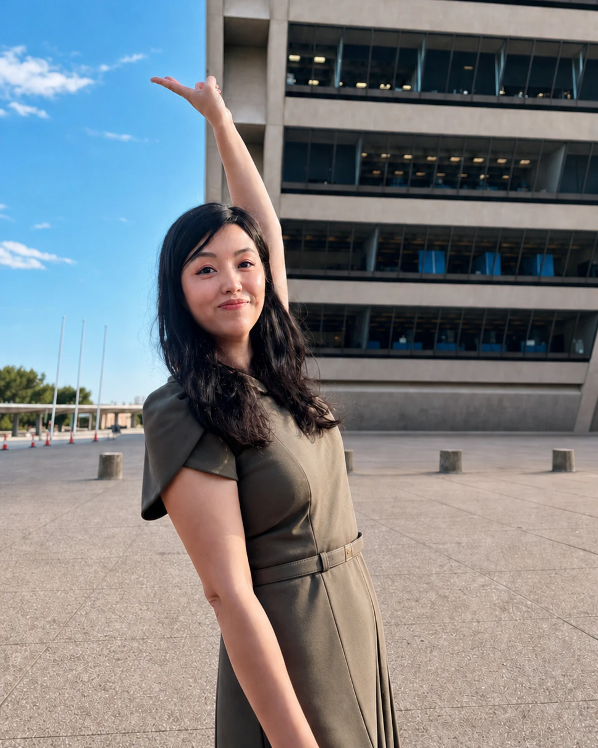 Joyce Tang at a Houston civic and industry event, photographed outdoors beside a modern public building