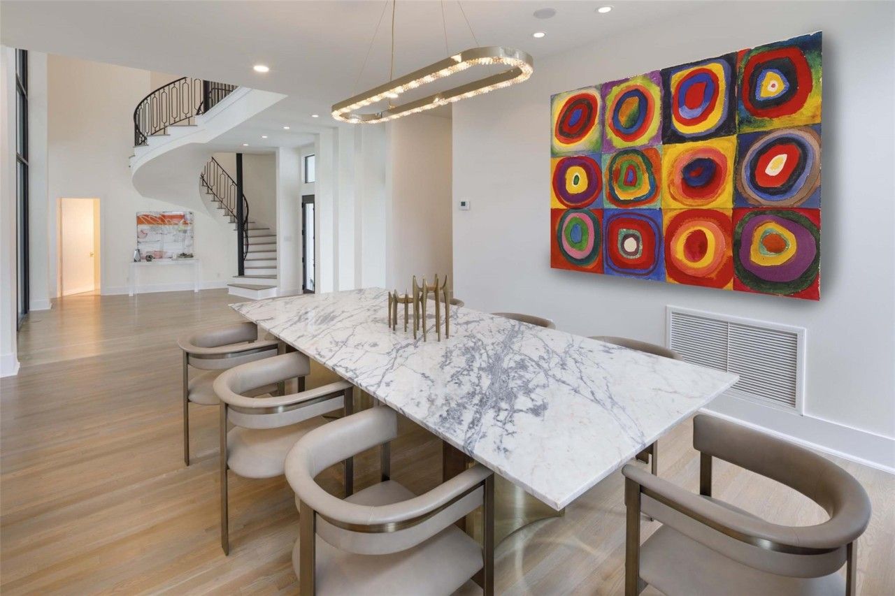 Open dining area and foyer with modern artwork