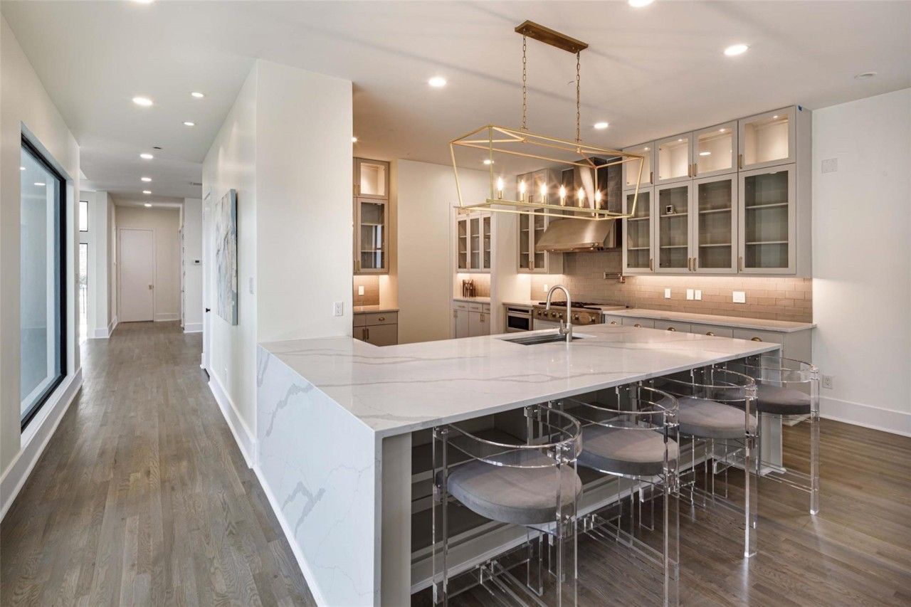 Wide view of the renovated kitchen and island seating