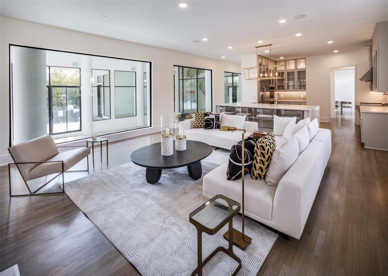 Bright main living room with fireplace and glass doors