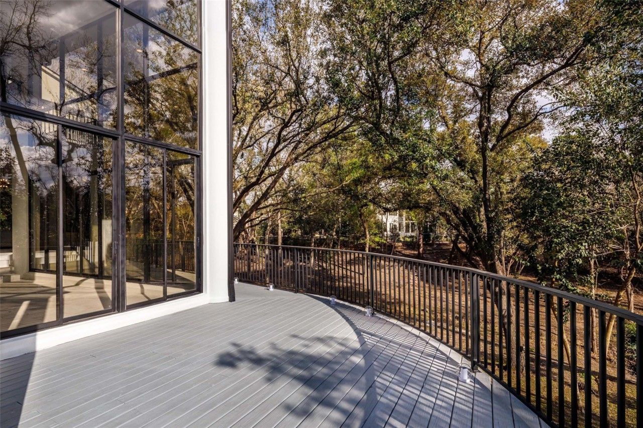 Raised outdoor terrace overlooking mature trees