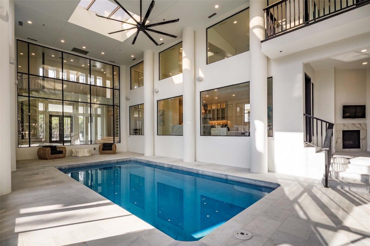 Climate-controlled indoor pool in a double-height room