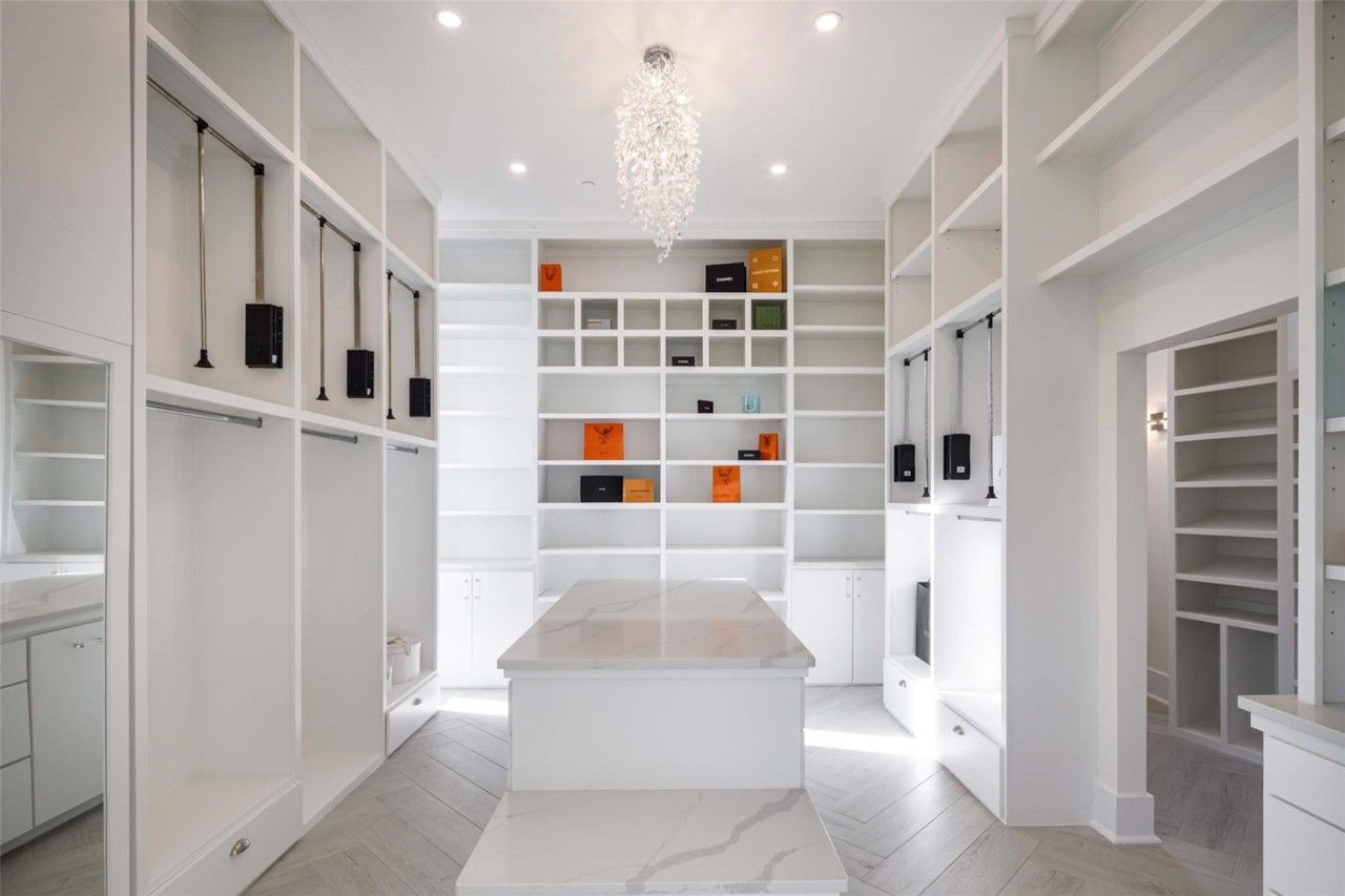 Custom walk-in closet with central storage island