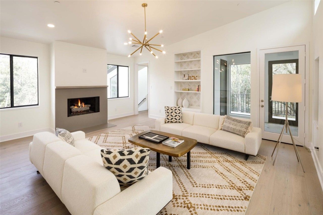 Upstairs living or game room with fireplace and built-ins